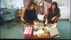 Two women packing beauty products in boxes on BBC Northwest news